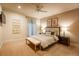 Inviting bedroom featuring a ceiling fan, neutral color palette, and bright natural light at 2800 S University Blvd # 184, Denver, CO 80210