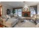 Comfortable living room featuring a fireplace, neutral color palette, and a sliding glass door at 2800 S University Blvd # 184, Denver, CO 80210