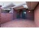 Brick patio space featuring red brick flooring, red brick walls, and a skylight at 2800 S University Blvd # 184, Denver, CO 80210