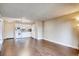 Bright kitchen with white appliances and laminate wood flooring at 1300 S Parker Rd Rd # 210, Denver, CO 80231