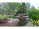 Serene pond and creek with landscaping at 1300 S Parker Rd Rd # 210, Denver, CO 80231