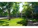 Tennis court with lush green grass at 1300 S Parker Rd Rd # 210, Denver, CO 80231