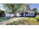 Spacious backyard featuring a detached garage, mature trees, and a well-maintained lawn at 4430 S Cherokee St, Englewood, CO 80110