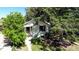 Home exterior with shade trees, well-manicured lawn and front garden at 4430 S Cherokee St, Englewood, CO 80110