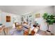 Bright living room with hardwood floors, white walls, a large window, and stylish furnishings at 4430 S Cherokee St, Englewood, CO 80110