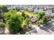 Aerial view of home, revealing a large, expansive yard, and mature trees with a convenient location at 1245 S Willow St, Denver, CO 80247