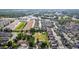 Aerial view of a residential neighborhood showcasing well-maintained homes and tree-lined streets on a bright day at 1245 S Willow St, Denver, CO 80247
