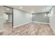 Finished basement featuring new flooring and a sliding door at 101 S 11Th Ave, Brighton, CO 80601