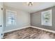 Bedroom featuring wood-look flooring, fresh paint and natural light at 101 S 11Th Ave, Brighton, CO 80601