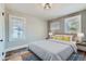 Bright bedroom featuring large windows, neutral tones, and carpet flooring at 101 S 11Th Ave, Brighton, CO 80601