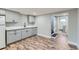 Basement kitchenette featuring grey cabinets and quartz countertops at 101 S 11Th Ave, Brighton, CO 80601