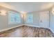 Bright, updated living room with wood-look flooring, fresh paint and new light fixtures at 101 S 11Th Ave, Brighton, CO 80601