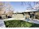 Charming backyard features a modern patio area, a patch of lawn and white rock landscaping at 1459 S Filbert Way, Denver, CO 80222