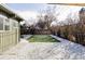 Spacious backyard featuring modern patio, a patch of lawn, and white rock landscaping at 1459 S Filbert Way, Denver, CO 80222