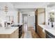 Spacious, modern kitchen featuring sleek wooden cabinetry and an open layout with plenty of natural light at 1459 S Filbert Way, Denver, CO 80222