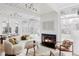 Inviting living room with a fireplace, large windows, and access to the outdoor area for relaxation at 1459 S Filbert Way, Denver, CO 80222