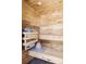 This modern sauna features wood-paneled walls and benches and a stacked rock heater at 1459 S Filbert Way, Denver, CO 80222