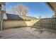 Backyard with a concrete patio and tall fencing, providing privacy at 7452 W Cedar Cir, Lakewood, CO 80226