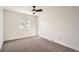 Clean, bright bedroom with ceiling fan and window at 7452 W Cedar Cir, Lakewood, CO 80226