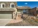 Exterior front view of a home featuring steps up to the front door and a well-kept lawn at 7452 W Cedar Cir, Lakewood, CO 80226