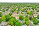 Aerial shot showcasing the neighborhood, mature trees, and the property's location at 2140 W 135Th Ave, Westminster, CO 80234