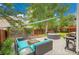 Inviting backyard featuring outdoor seating, hot tub, barbecue, and mature trees offering shade and privacy at 2140 W 135Th Ave, Westminster, CO 80234