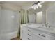 Bright bathroom featuring a double sink vanity, a bathtub, and tiled walls at 2140 W 135Th Ave, Westminster, CO 80234