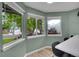Bright breakfast nook with multiple windows offering views of the surrounding greenery at 2140 W 135Th Ave, Westminster, CO 80234