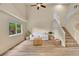 Spacious living room with vaulted ceilings, a staircase, and natural light at 2140 W 135Th Ave, Westminster, CO 80234