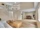 Open-concept living room featuring a modern staircase, wood floors, and natural light at 2140 W 135Th Ave, Westminster, CO 80234