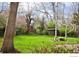 Lush backyard featuring mature trees and a storage shed at 1333 S Eudora St, Denver, CO 80222