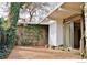 Private patio area with brick pavers and mature climbing vines at 1333 S Eudora St, Denver, CO 80222