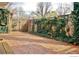 Spacious brick patio area with climbing vines on the fence at 1333 S Eudora St, Denver, CO 80222