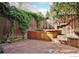 Relaxing patio area featuring a hot tub and brick pavers at 1333 S Eudora St, Denver, CO 80222