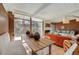 Open dining area with a rustic table, bench seating, and natural light for gatherings at 1333 S Eudora St, Denver, CO 80222