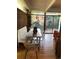 Dining room featuring a rustic table, bench seating, wood floors, and access to the outdoor patio at 1333 S Eudora St, Denver, CO 80222