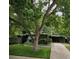 Charming single-story home with mature trees, a stone accent garden, and a welcoming entrance at 1333 S Eudora St, Denver, CO 80222