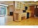 Bright kitchen features wood floors, cabinets, and modern appliances for a warm and inviting space at 1333 S Eudora St, Denver, CO 80222