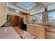Sun-filled kitchen with wooden cabinets and a skylight at 1333 S Eudora St, Denver, CO 80222