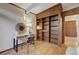 Bright office with a built-in bookcase, natural light, and a modern desk at 1333 S Eudora St, Denver, CO 80222