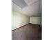Wide-open basement with neutral carpet, light walls, and tile ceiling at 15983 E Loyola Dr, Aurora, CO 80013
