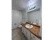 Bright bathroom with a single vanity and ample counter space at 15983 E Loyola Dr, Aurora, CO 80013