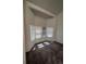 Bright bedroom with a bay window providing natural light and neutral carpet at 15983 E Loyola Dr, Aurora, CO 80013