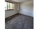 Bedroom featuring a large window for natural light at 15983 E Loyola Dr, Aurora, CO 80013