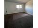 Bedroom with neutral carpeting and a window for natural light at 15983 E Loyola Dr, Aurora, CO 80013