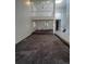 Spacious open-concept living room with loft, staircase, neutral-toned carpet, and tile flooring at 15983 E Loyola Dr, Aurora, CO 80013