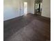 Living room with neutral carpet, paint, and open floor plan at 15983 E Loyola Dr, Aurora, CO 80013
