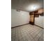 Room with tile flooring, built-in shelves, and ceiling fan lights at 15983 E Loyola Dr, Aurora, CO 80013