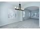Bright dining area with modern chandelier and neutral carpeting at 19058 E Hickock Dr, Parker, CO 80134