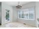 Dining area with exterior door to the backyard and bright window with natural light at 19058 E Hickock Dr, Parker, CO 80134